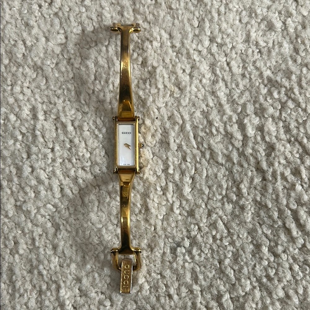 Gucci Gold Bracelet Watch with mother of pearl face